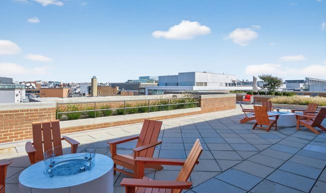 rooftop deck with fire pits and chairs