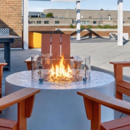 fire pit surrounded by chairs